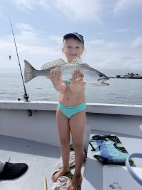 captain was  patient with granddaughter teaching her to fish